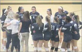  ?? STAFF PHOTO BY TED BLACK ?? La Plata High School volleyball coaches and players huddle prior to the start of Monday’s match at Patuxent. La Plata suffered its second straight loss on Monday after the Panthers rallied to prevail in the fifth set tiebreaker.