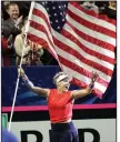  ?? (AP/Elaine Thompson) ?? Bethanie Mattek-Sands leads her teammates after the United States advanced in a Fed Cup qualifying match over Latvia.