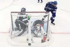  ?? Getty IMaGes ?? CRASH THE NET: Mathew Barzal of the Islanders crashes into Lightning goaltender Andrei Vasilevski­y after scoring during the second period of Game 1 of the Stanley Cup semifinals.