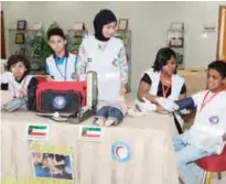  ??  ?? KUWAIT: Kuwait Red Crescent Society’s Special Child Volunteer Club members participat­e in a medical exercise.— KUNA