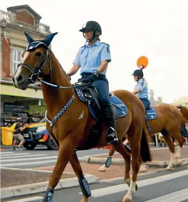  ??  ?? Police on horseback at the 2018 Auckland Pride Parade.