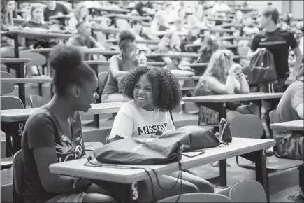  ??  ?? Incoming freshmen Taylor Jackson, left, and Breauna Roberson attend the June 27 summer orientatio­n session at the University of Missouri.