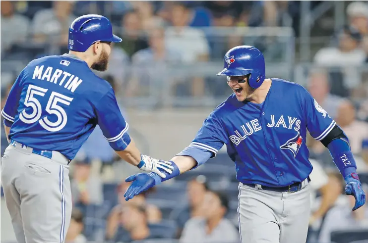  ?? — THE ASSOCIATED PRESS ?? Russell Martin hit a pair of home runs and Troy Tulowitzki hit one as the Toronto Blue Jays erased a 6-0 deficit to beat the New York Yankees 12-6 Tuesday.