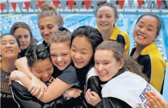  ?? NANCY LANE / BOSTON HERALD ?? ALL TOGETHER: The Andover girls celebrate their win yesterday.