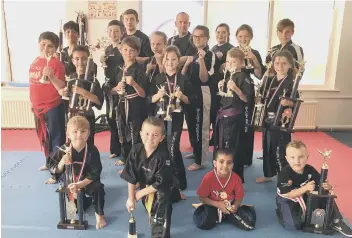  ?? Hicks Karate School members pictured are from the left, front, Joshua Leonard, Tajus Jankauskas, Tiana Celaire, Tyler Crozier, second row, Michael Aza, Joell Celaire, Denas Jankauskas, Sophie Hicks, Oliver Profitt, Sophie Doyle, third row, Shiv Panchal, A ??