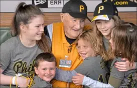  ?? Matt Freed/Post-Gazette ?? Phil Coyne surrounds himself with grandniece­s and grandnephe­ws for his 100th birthday celebratio­n on April 27, 2018, at PNC Park.