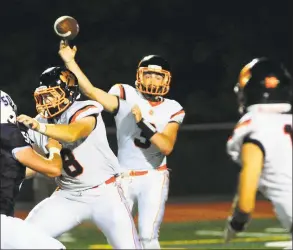  ?? Christian Abraham / Hearst Connecticu­t Media ?? Ridgefield quarterbac­k Owen Matthews complete a pass against Staples in September.