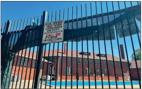  ?? (AP/Claire Savage) ?? The empty pool at the Hamlin Park Pool remains closed to swimmers June 16 in Chicago. Chicago’s public pools will remain closed until July 5, according to park superinten­dent and CEO Rosa Escareno.