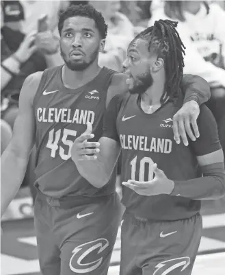  ?? DAVID RICHARD/USA TODAY SPORTS ?? Cavaliers guards Donovan Mitchell (45) and Darius Garland talk in the fourth quarter against the Pacers on Friday.