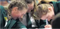  ??  ?? Happy team . . . Craighead Diocesan School pupils (from left) Mya Johnson, Phoebe EvansHoeff­gen and Rosie Winter (all 13) have a laugh during the quiz.