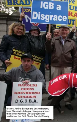  ??  ?? Sisters Janine Barber and Lesley Barber, from Glasnevin, take part in a protest over the sale of Harold’s Cross greyhound stadium at the Dáil. Photo: Gareth Chaney