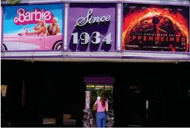  ?? . Photograph: Chris Pizzello/AP ?? But which film will they choose? … a patron buying their ticket at the Los Feliz cinema in Los Angeles in July