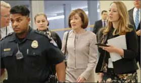  ?? AP Photo/Pablo Martinez Monsivais ?? Confirmati­on: Sen. Susan Collins, R-Maine, is followed by members of the media as she walks to the Capitol before a vote to advance Brett Kavanaugh's nomination to the Supreme Court, on Capitol Hill, Friday, in Washington.