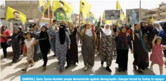  ?? — AFP ?? QAMISHLI, Syria: Syrian-Kurdish people demonstrat­e against demographi­c changes forced by Turkey to repopulate Kurdish areas yesterday.