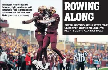  ??  ?? Minnesota receiver Rashod Bateman, right, celebrates with teammate Tyler Johnson during last Saturday’s win over Penn State. [THE ASSOCIATED PRESS]