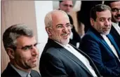  ?? JOHN THYS/GETTY-AFP ?? Iranian Foreign Minister Mohammad Javad Zarif Khonsari, center, attends a meeting Thursday at EU headquarte­rs. Support for the Iran nuclear deal is strong in Europe.