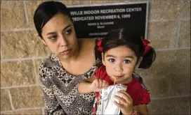  ?? RESHMA KIRPALANI / AMERICAN-STATESMAN ?? Rosanna Garcia and her daughter Mia Franco, 2, stayed at the Smithville Recreation Center after being forced to leave Bay City because of Tropical Storm Harvey. The center sheltered about 40 storm evacuees.