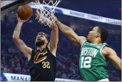  ?? RON SCHWANE — THE ASSOCIATED PRESS ?? The Cavaliers’ Dean Wade (32) shoots against the Celtics’ Grant Williams during the first half Wednesday.