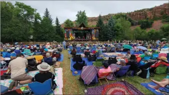  ?? DALLAS HELTZELL — BIZWEST ?? Crowds listen to performers at Planet Bluegrass on the northwest edge of Lyons.