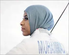  ?? Ezra Shaw Getty Images ?? IBTIHAJ MUHAMMAD felt awkward playing volleyball or running track with her head covered. “I would get stares,” she said. “Fencing found me.”