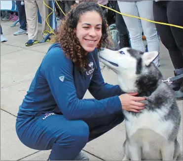  ?? PAT EATON-ROBB/AP PHOTO ?? UConn’s Kia Nurse pets school mascot Jonathan during a send-off rally outside Gampel Pavilion in Storrs on Tuesday, where the team boarded a bus to depart for the airport and a flight to the Final Four in Dallas.