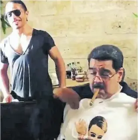 ?? AFP ?? Como un rey. Maduro se fuma un habano luego de la cena.