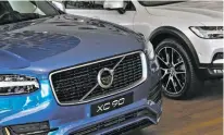  ??  ?? A Volvo XC 90 is shown Wednesday at Volvo Cars Showroom in Stockholm, Sweden. Volvo Cars CEO Hakan Samuelsson said that all Volvo cars will be electric or hybrid within two years. The Chinese-owned automotive group plans to phase out the convention­al...