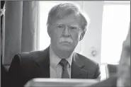  ?? AP/EVAN VUCCI ?? National security adviser John Bolton listens Monday as President Donald Trump speaks during a cabinet meeting at the White House in Washington.