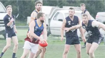  ??  ?? Warragul Industrial­s’ player Shane Brewster turns to size up the goals.