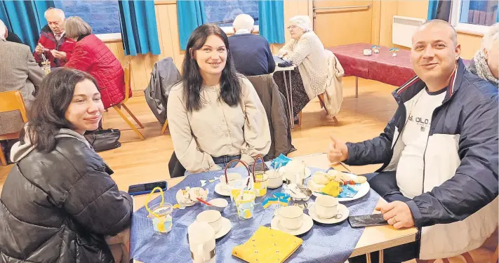  ?? ?? Solidarity Guests Tanye, Julia and Sasha from Ukraine enjoying their tea during the recent event at St Anne’s Episcopal Church in Coupar Angus