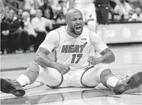  ?? Michael Reaves / Getty Images ?? The Heat’s P.J. Tucker helped harass 76ers star James Harden into a 5 for 13 shooting night, and his hustle came up big in a key third-quarter sequence.