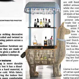  ?? ?? Llama is a bar cabinet made of rattan spokes on metal, with a canopy, compartmen­ts, table top and glass holders.