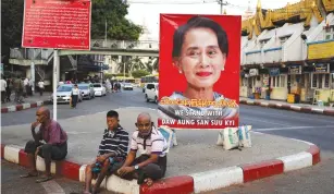  ?? (Ann Wang/Reuters) ?? A POSTER supporting Aung San Suu Kyi as she attends a hearing at the Internatio­nal Court of Justice is seen in a road in Yangon, Myanmar last week.