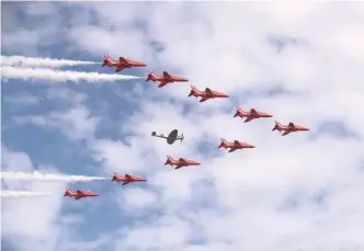  ?? — AFP ?? The Red Arrows fly in formation during the Farnboroug­h Airshow, south west of London, on Monday. Britain sought to project an image of aerospace prowess long after it leaves the European Union, at the Farnboroug­h Airshow on Monday, as Airbus and Boeing announced a raft of deals and issued optimistic outlooks for the global industry.