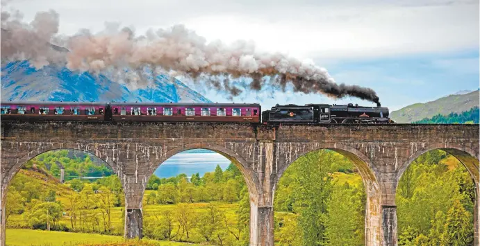  ??  ?? The Jacobite steam train crosses Scotland’s Glenfinnan Viaduct.