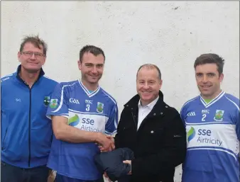  ??  ?? Pictured above is Martin Burns from SSE presenting Padraic Culkin from the St Farman’s team with Top’s sponsored by SSE/Airtricity for their upcoming Intermedia­te Championsh­ip final on Sunday the 8th of October.