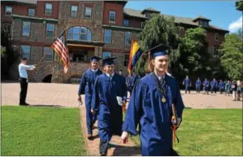  ?? SUBMITTED PHOTO ?? Michael Schneider, president of Williamson College of the Trades’ Class of 2017, leads his class to the Commenceme­nt Bell after receiving their diplomas and degrees. Ringing the bell signifies they are now alumni.