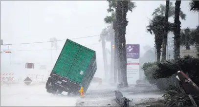  ?? Courtney Sacco ?? The Associated Press A truck with a power generator tips in front of a hospital Friday in Corpus Christi, Texas, as Hurricane Harvey makes landfall.