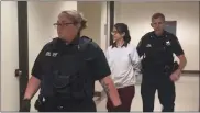  ?? CARL HESSLER JR. — MEDIANEWS GROUP ?? Naseema Sami, 45, of Folsom, is escorted a from Montgomery County courtroom after a pretrial hearing