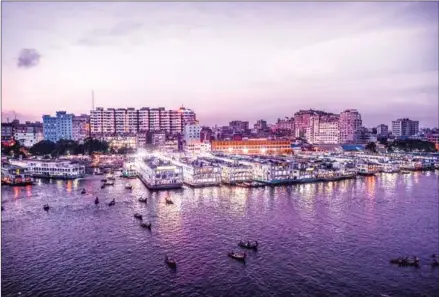  ?? AFP ?? A general view of the Dhaka River Port located on the banks of the Buriganga river. The urban population of Bangladesh has been increasing by 3.17 per cent annually during the last five years, but Dhaka’s ability to provide contempora­ry urban services to such a large number of people is not growing at the same pace, according to the UN World Population Prospects data.