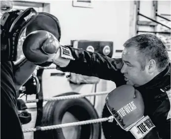  ??  ?? Michael ran Plains Farm Amateur Boxing Club, teaching a younger generation how to box.