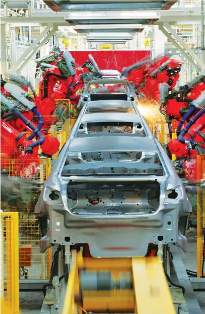  ??  ?? A car is modeled in the production line of SAIC Motor Corporatio­n Ltd’s Lingang factory.