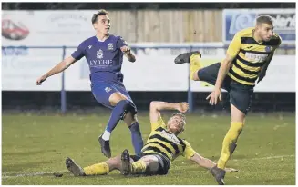  ?? ?? ONE AND ONLY Baffins (blue) above inflict Hamworthy’s sole Wessex League this season on the Dorset club. Below - Tom Jeffes, left, wins this header for US Portsmouth