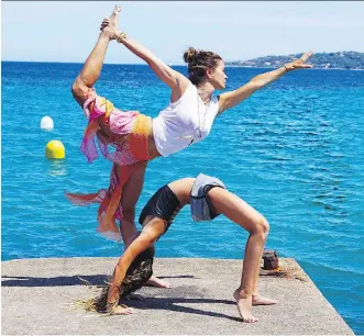  ?? THE ASSOCIATED PRESS/FILES ?? Brooke Burke-Charvet works out with her daughter, Rain, in Malibu, Calif.