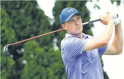  ??  ?? Jordan Spieth plays a shot in the second round on Friday.