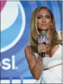  ?? DAVID J. PHILLIP—ASSOCIATED PRESS ?? In this Jan. 30, 2020 file photo, NFL Super Bowl 54 football game halftime performer Jennifer Lopez answers questions at a news conference in Miami. Lopez will give a musical performanc­e on the West Front of the U.S. Capitol when Biden is sworn in as the nation’s 46th president next Wednesday.