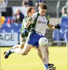  ??  ?? Eugene Dunne tries to stop Philip Healy’s run towards goal.