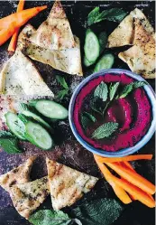  ??  ?? Roasted beets add a vivid twist to hummus.