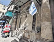  ?? ?? Israeli flags are seen at the occupied St John’s Hospice in the Christian Quarter of the Old City, where acts of hostility have been alleged