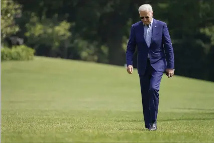  ?? PABLO MARTINEZ MONSIVAIS — THE ASSOCIATED PRESS ?? President Joe Biden walks on the South Lawn of the White House after stepping off Marine One, Sunday, July 25, in Washington. Biden is returning to Washington after spending the weekend in Delaware.